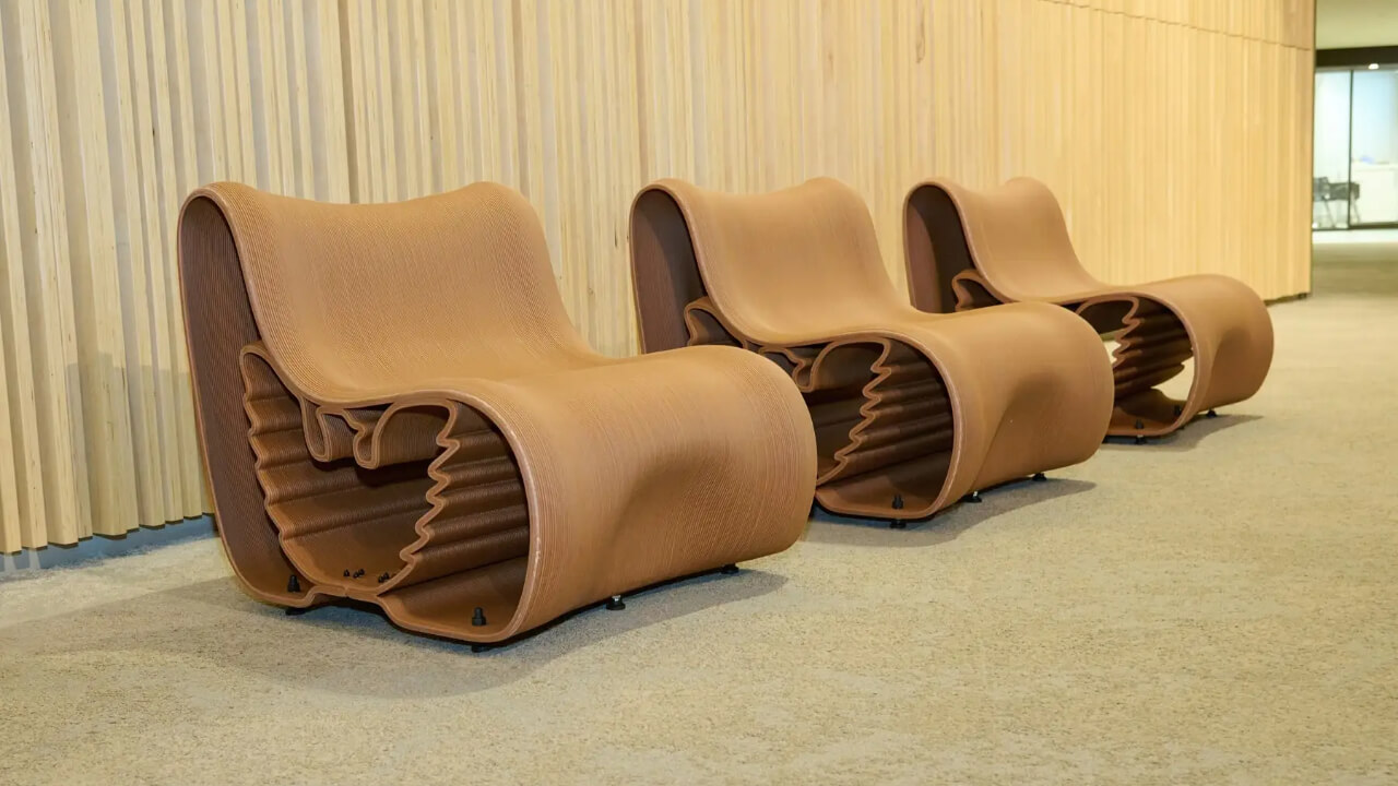 Chair upcycled from Luxembourg Pavilion materials, featuring Sophia University's eagle emblem