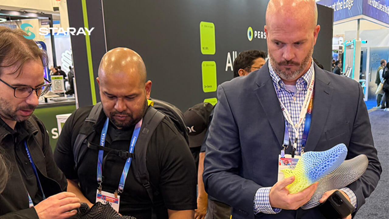 Industry professionals examine the manufacturing details of STARAY's award-winning 3D printed shoes