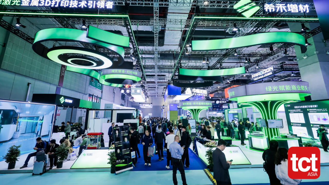 Addireen's booth — green lasers, green branding.