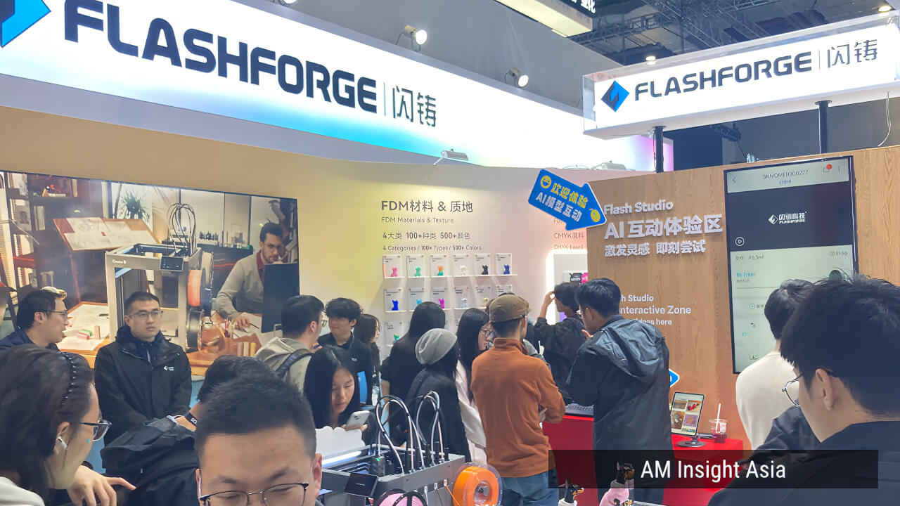 FLASHFORGE booth at TCT Asia 2026, with the Flash Studio AI Interactive Zone drawing a steady crowd.