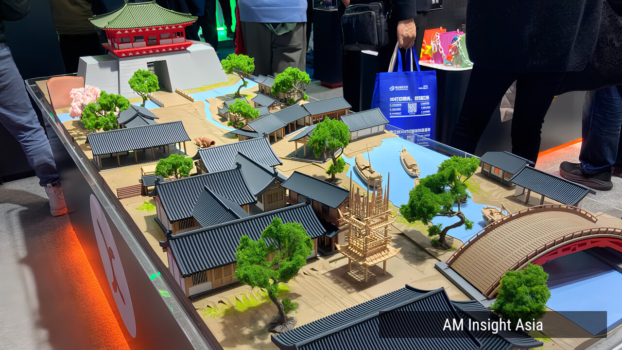 The large-scale East Asian architectural diorama at kexcelled — temples, bridges, and trees printed across multiple materials and colors.