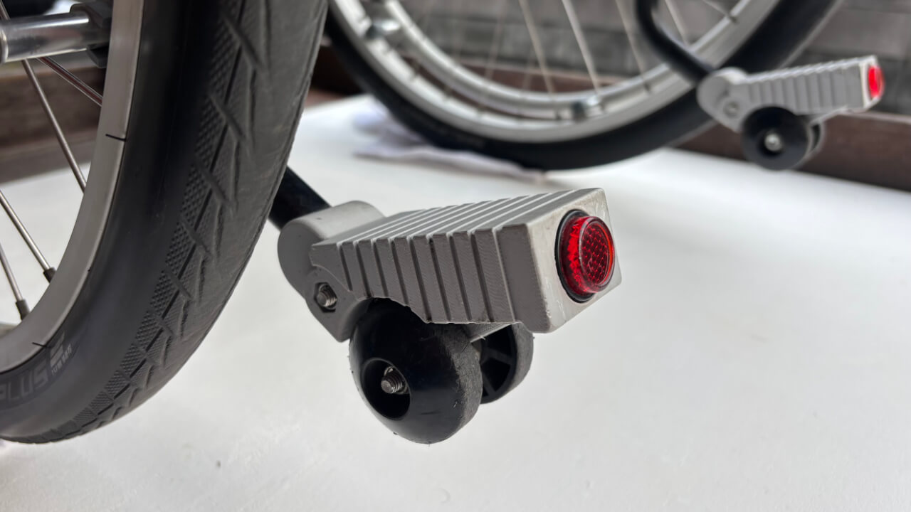 A 3D printed tipping lever installed on the YAMAHA JWX-1 PLUS+ power assist wheelchair unit.