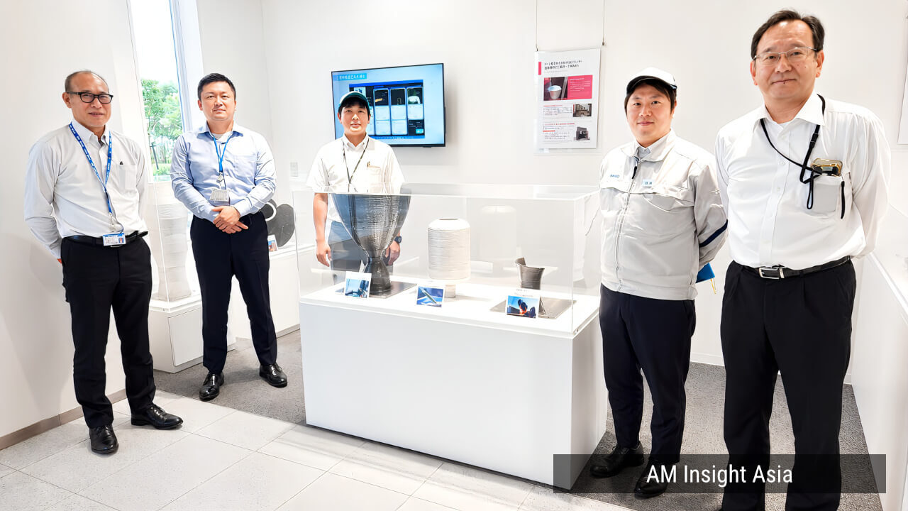 Sample builds on display at DAIHEN's development site, with staff from the project | Photo: AM Insight Asia