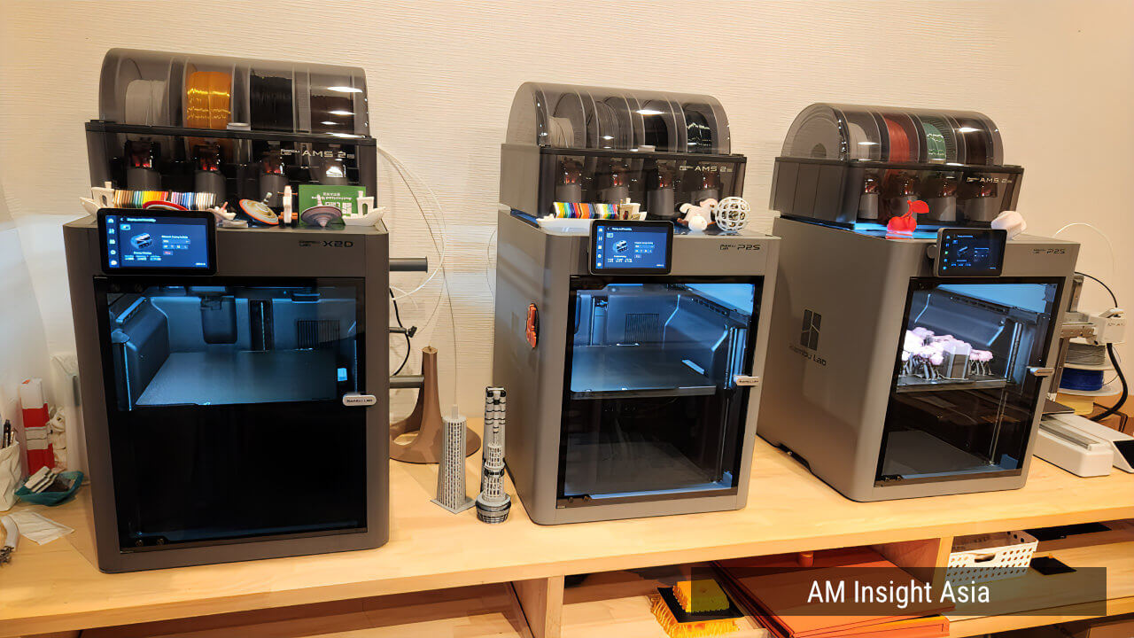 A shelf lined with printers including the X2D and P2S | Photo: AM Insight Asia