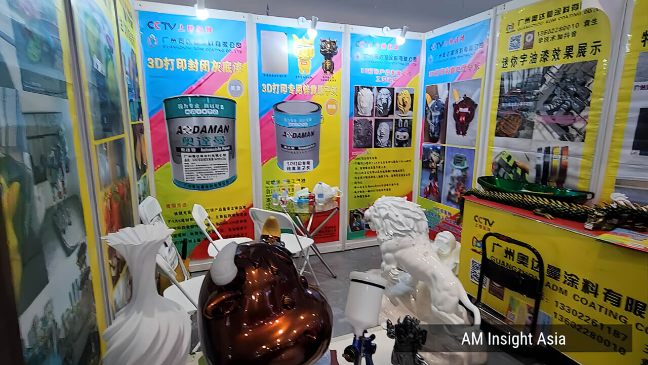 AODAMAN's coatings booth, showing examples of different textured finishes. | Photo: AM Insight Asia