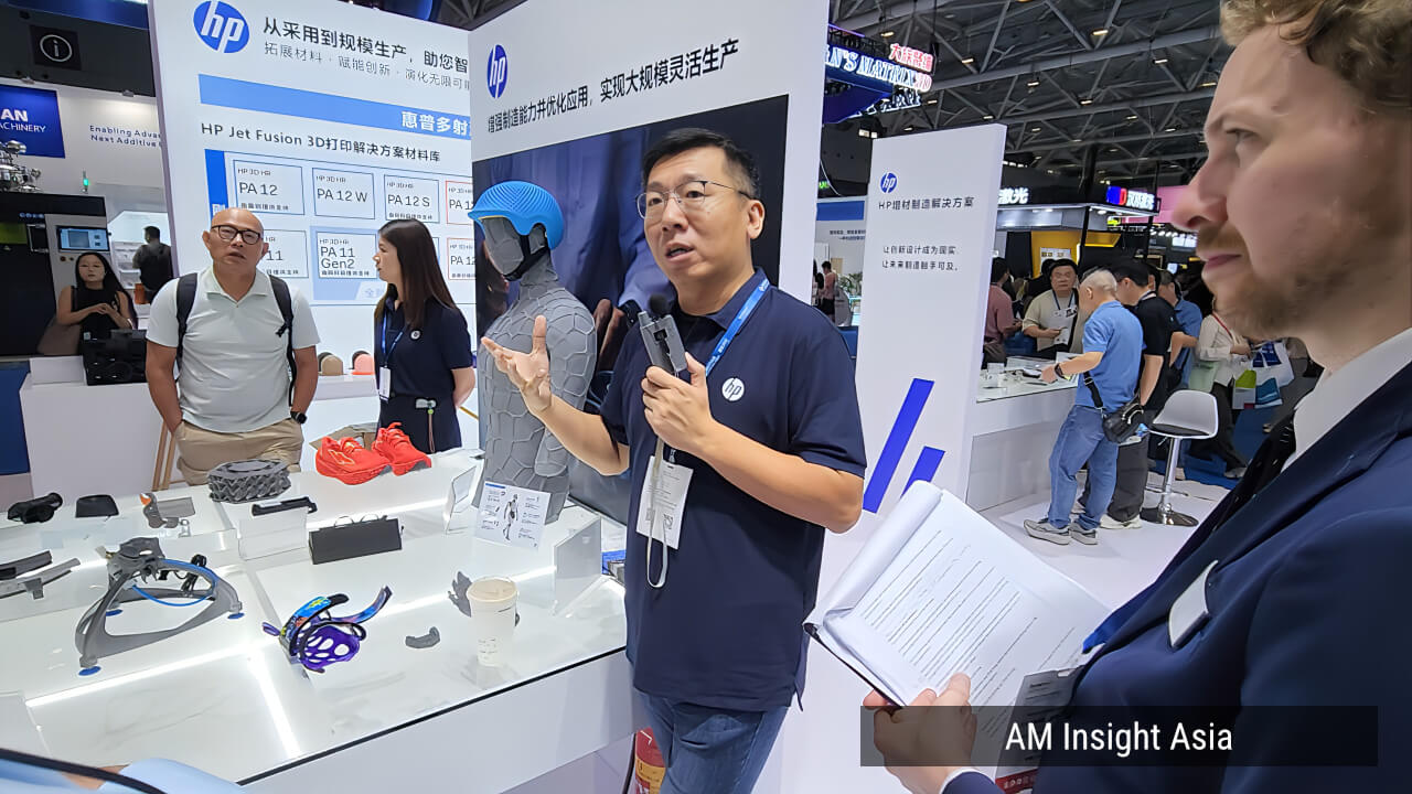The HP booth, visited during the media tour, showcasing 3D printed footwear made with MJF technology. | Photo: AM Insight Asia
