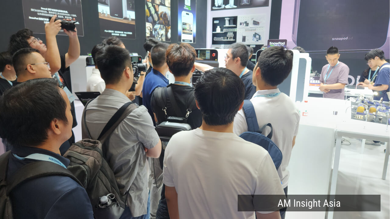 Visitors and camera crews gather around SnowPod. | Photo: AM Insight Asia