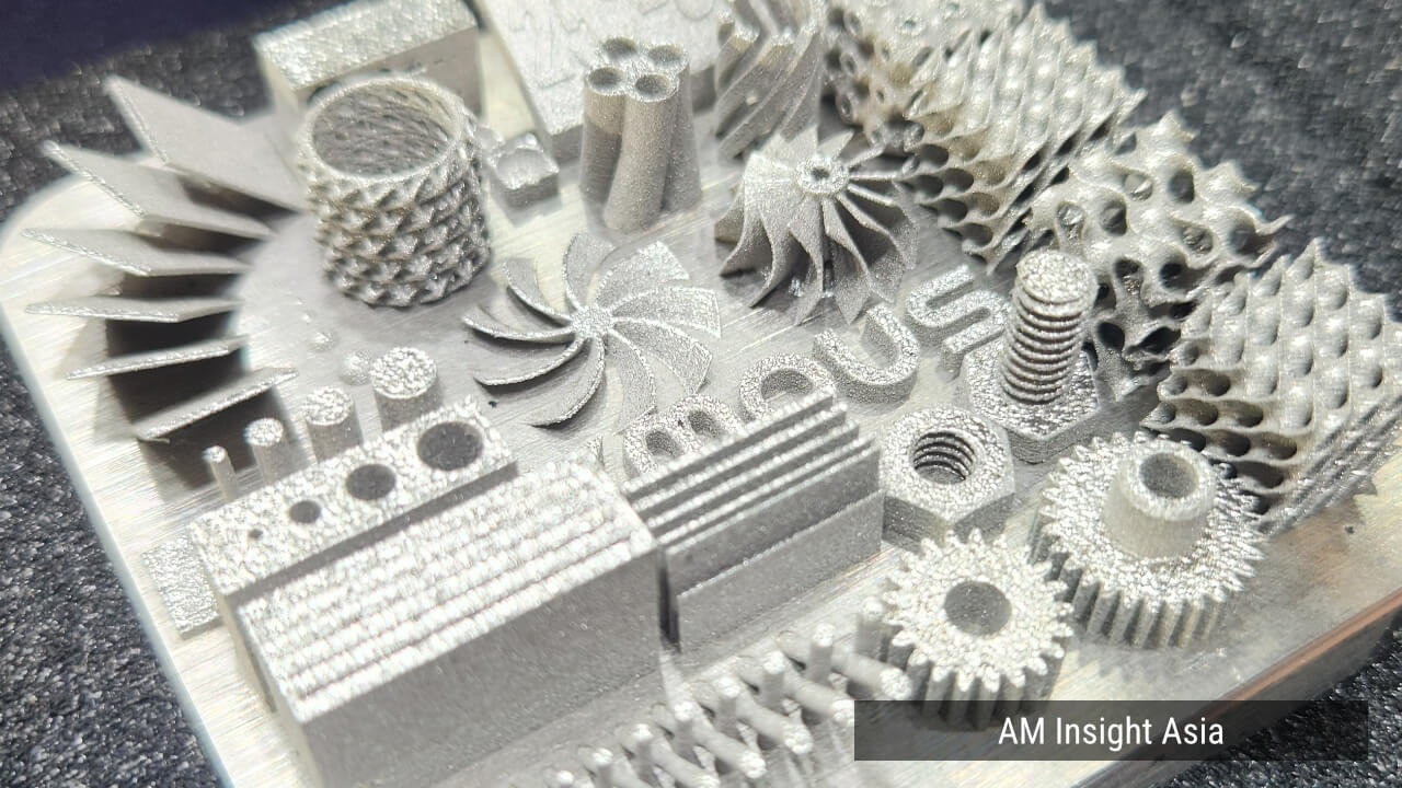 Test parts including gears, an impeller, threaded parts and lattices on a single build plate. | Photo: AM Insight Asia