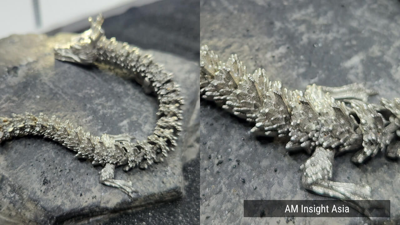 An articulated dragon printed in one piece, with a close-up of its scales (right). | Photo: AM Insight Asia